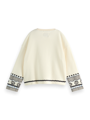 Sweater met blauw borduursel 100